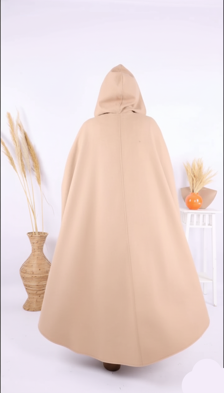 Beige hooded cloak on a white background