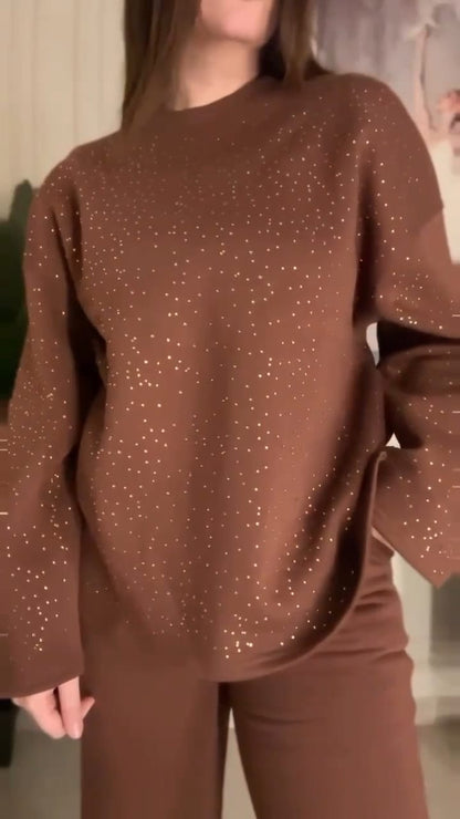 Brown outfit with bell sleeves worn by a person indoors.