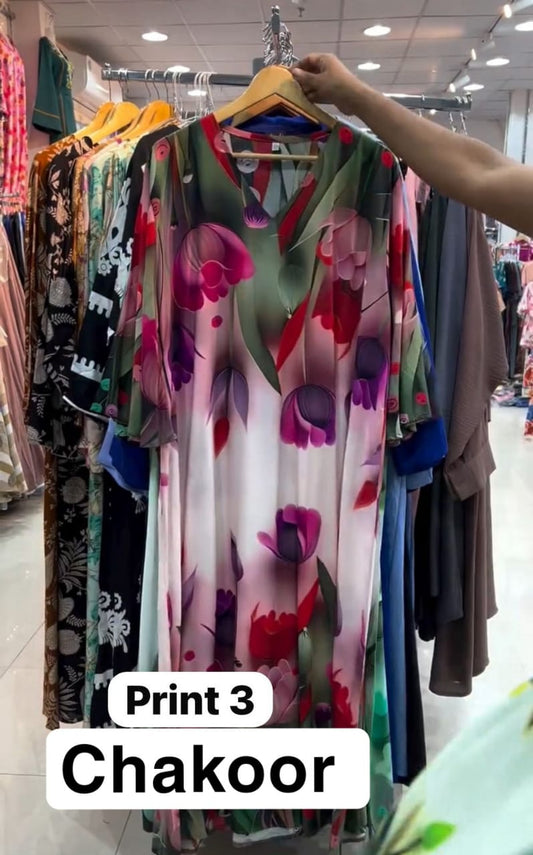 Chakoor Print 3 long floral dress featuring large pink and purple tulip patterns on a white background with blue cuff details.