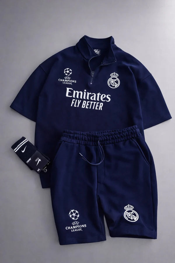 Real Madrid sports tracksuit set for women featuring short sleeve zip polo shirt and matching shorts with UEFA Champions League logo, Emirates Fly Better print and Nike socks 01