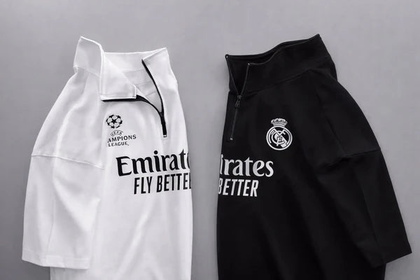 Real Madrid sports tracksuit set for women featuring short sleeve zip polo shirt and matching shorts with UEFA Champions League logo, Emirates Fly Better print and Nike socks 04