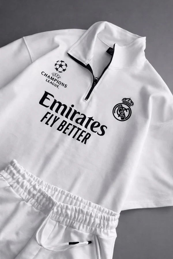 Real Madrid sports tracksuit set for women featuring short sleeve zip polo shirt and matching shorts with UEFA Champions League logo, Emirates Fly Better print and Nike socks 09