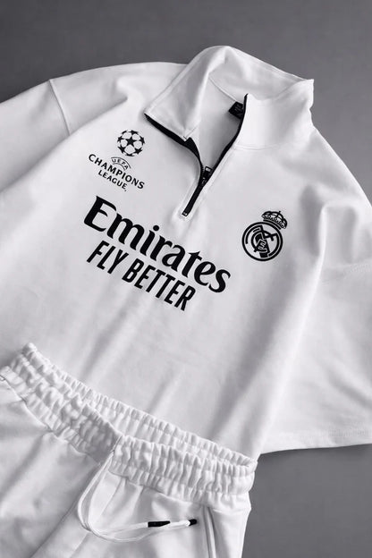 Real Madrid sports tracksuit set for women featuring short sleeve zip polo shirt and matching shorts with UEFA Champions League logo, Emirates Fly Better print and Nike socks 09