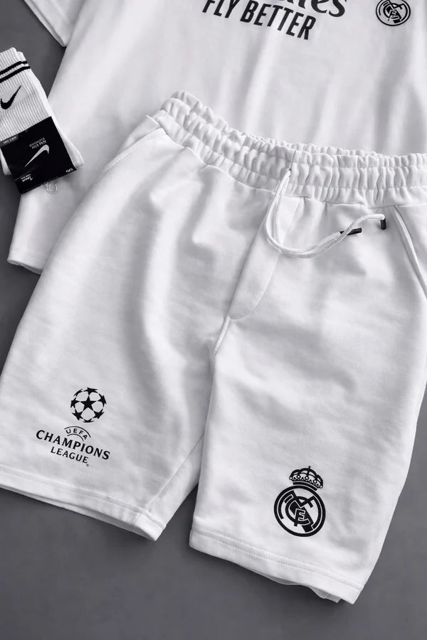 Real Madrid sports tracksuit set for women featuring short sleeve zip polo shirt and matching shorts with UEFA Champions League logo, Emirates Fly Better print and Nike socks 10