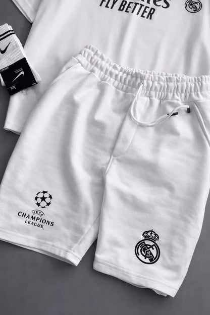 Real Madrid sports tracksuit set for women featuring short sleeve zip polo shirt and matching shorts with UEFA Champions League logo, Emirates Fly Better print and Nike socks 10