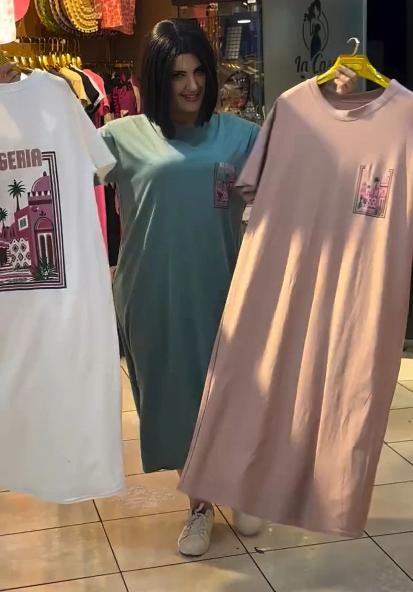 Short-sleeve t-shirt dress featuring a large "ALGERIA" graphic print with architectural and palm tree illustrations on the back 03