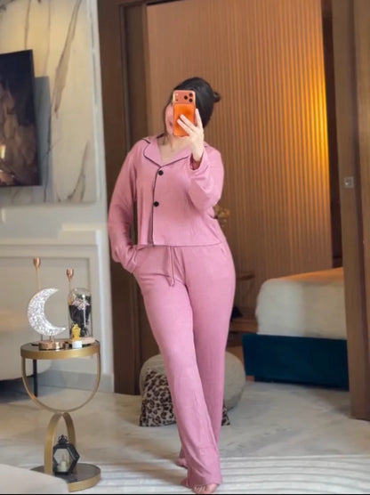 Stylish woman wearing a comfortable two-piece co-ord set with long sleeve top and loose fit pants, taking a mirror selfie in a modern bedroom setting, perfect casual loungewear outfit for women 03