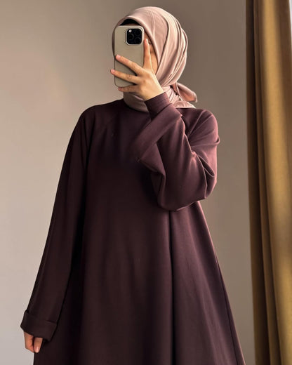 Women wearing Brown Chakoor Kashmiri winter fleece long co-ord set in Pakistan 2026 trendy modest fashion 1