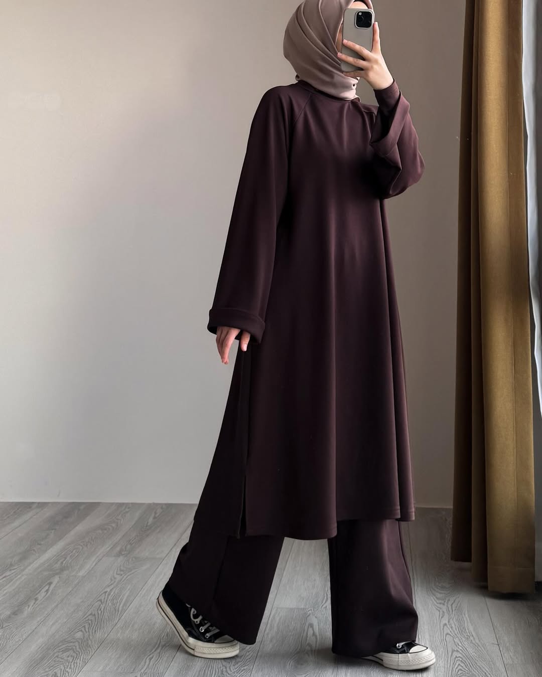 Women wearing Brown Chakoor Kashmiri winter fleece long co-ord set in Pakistan 2026 trendy modest fashion 2
